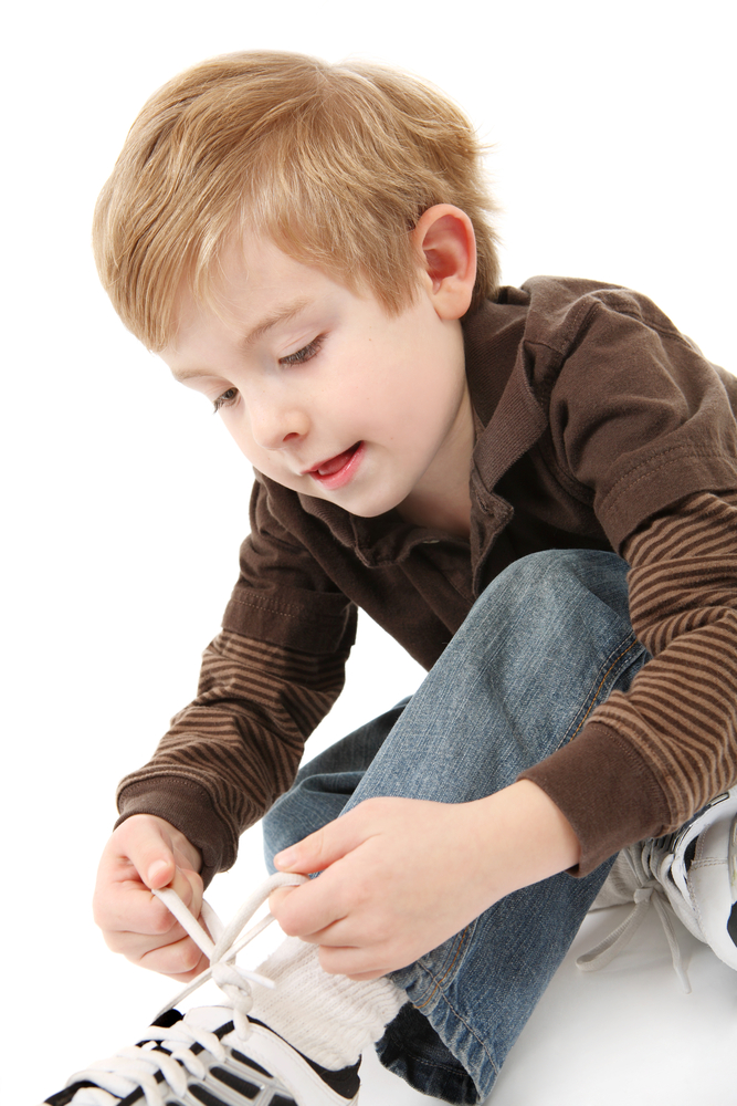 Boy learning to tie shoes My Child’s Speech